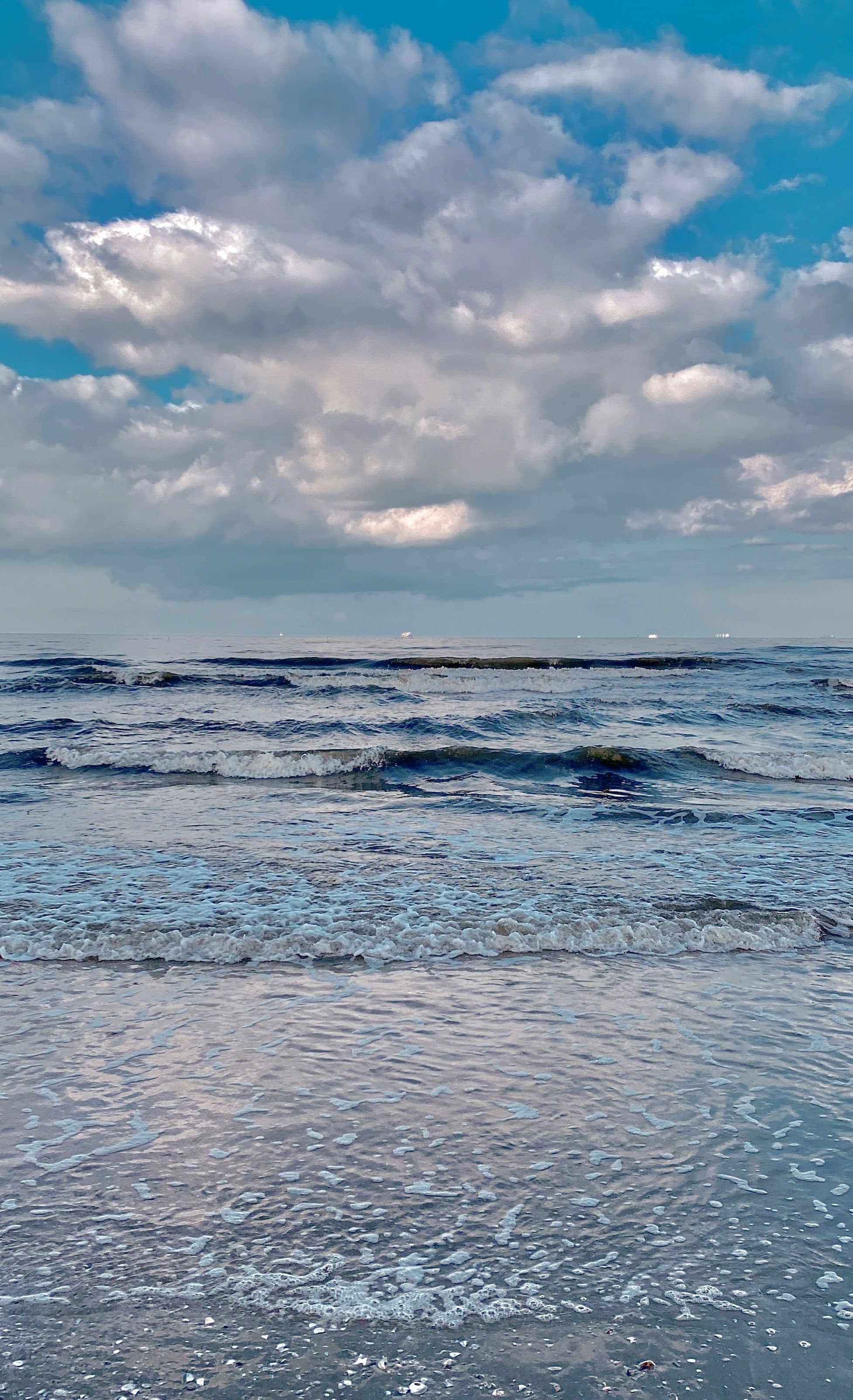 sea air, clouds over gentle surf
