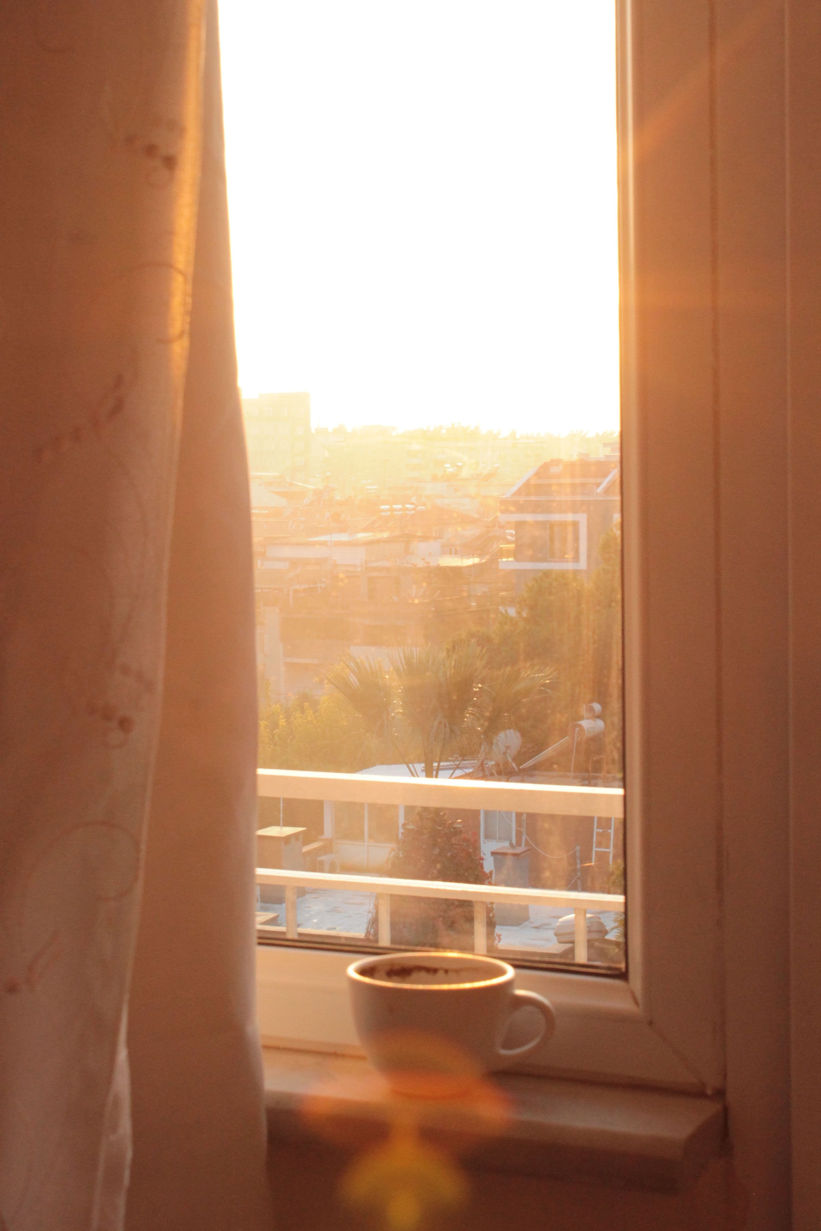 morning sunlight through a curtained window